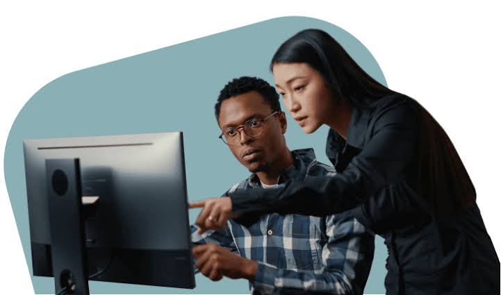 Two analysts reviewing live traffic-quality data together